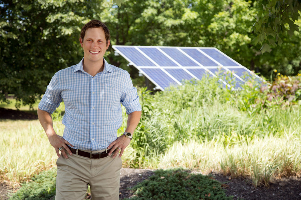 Photo of Ohio House Representative Casey Weinstein standing near solar panels