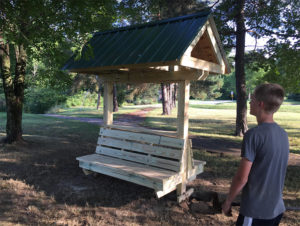 Photo of a covered park bench built bu Kurt Ruehr
