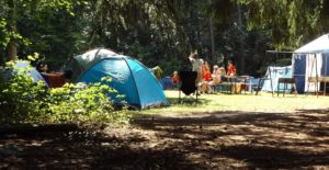 Photo of tents at camp in the day